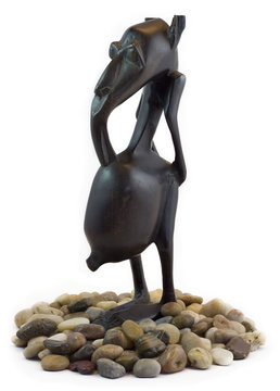 wooden tokoloshe figure. zulu mythology evil spirit.