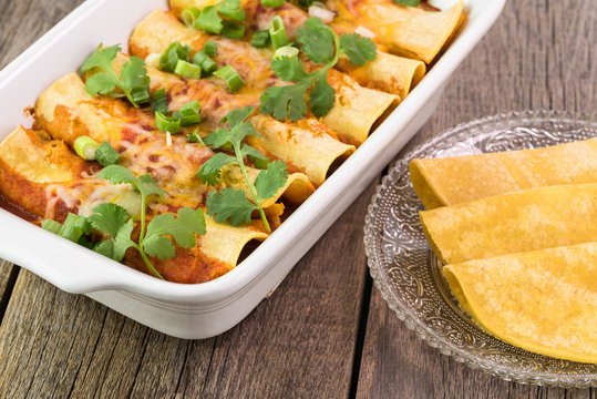 Casserole dish with mexican food - beef enchiladas.
