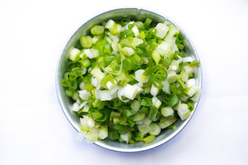 Scallion or onion tree shredded on aluminum silve cup.