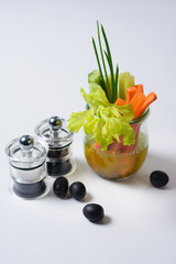 carrots , augures and onions in a glass