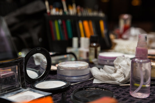 Various make up itmes on a dresser