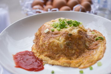 fried egg omelette with scallion and white sesame ready to serve on dish.