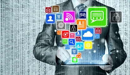 Business man using tablet PC with social media icon set