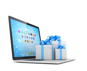 Gift box with ribbon bow on laptop keyboard