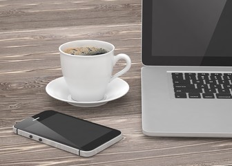 Laptop smartphone and coffee cup on wood table