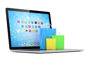 laptop and  shopping pags on white background