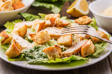 Fototapeta na wymiar Homemade Chicken Caesar Salad with Cheese and Croutons..