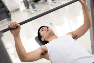 young man working out in modern gym