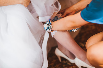 European bride in gown, garter and stockings