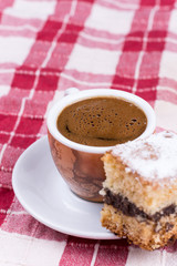 Cup of coffee with cakes on the plate