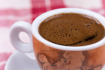 Close macro view of cup of coffee ballons