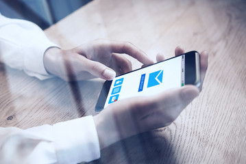 Close up of generic design smart phone holding in female hands for texting message. Email send icons screen