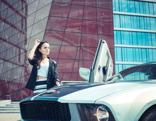 Business stylish woman near sport car