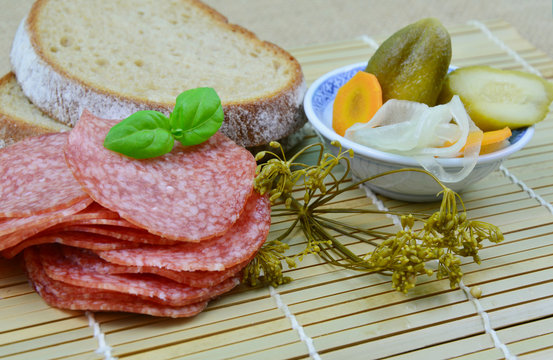 easy menu. (Soft focus, lens blur).
salami, bread and pickle cucumbers