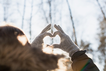 hands in shape of love heart