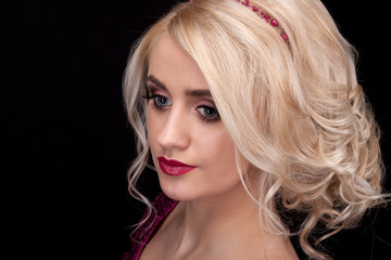 Fototapeta premium Portrait of the blonde on a black background