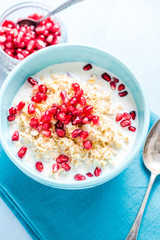 Fresh summer breakfast, cereals with pomegranate.