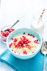 Fresh summer breakfast, cereals with pomegranate.