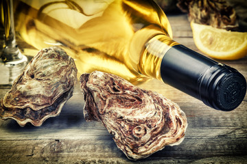 Fresh oysters with white wine bottle © Symbiot