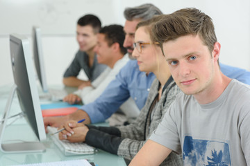 Obraz na płótnie Canvas Students using computers