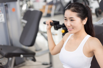Fototapeta na wymiar beautiful girl working out in modern gym