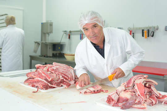 Man Cutting Meat