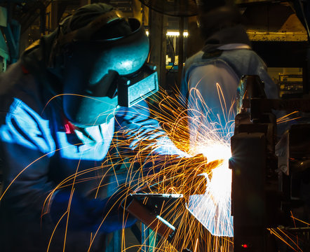 welding worker in the automotive part in Industrial