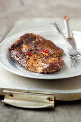Well-done beef steak on a plate,shallow depth of field
