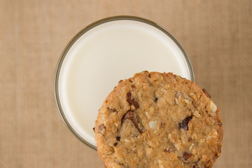 Glass of milk and oatmeal cookies, topview