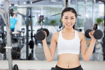 beautiful girl working out in mdoer gym