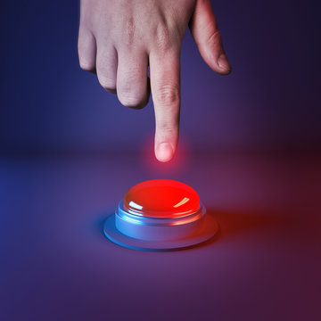 Pushing A Panic Button. A person about to press a big red button.