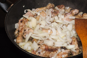 cooking food in frying pan
