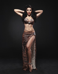 Beautiful belly dancer in the studio