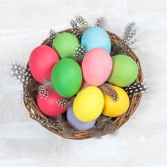 Fototapeta na wymiar Colorful Easter eggs in basket