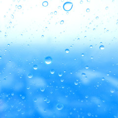 Close-up of water drops on glass surface as background