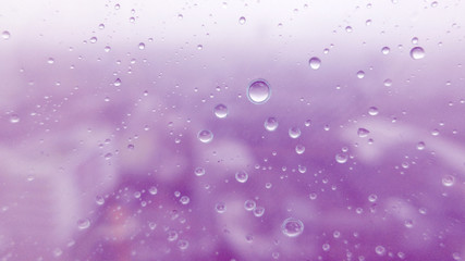 Close-up of water drops on glass surface as background
