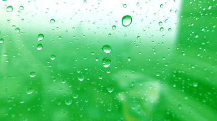 Close-up of water drops on glass surface as background