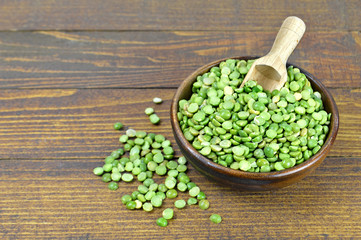 Lentil beans in bowl on wooden background