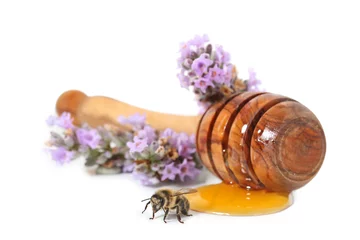 Zelfklevend Fotobehang miel avec abeille sur fond blanc © guy