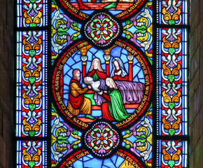 Stained glass window depicting the death of the fiirst born