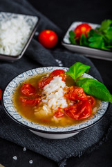 Fresh tomato soup with rice and cherry tomatoes