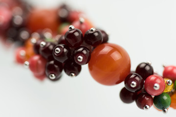 Natural mineral women necklace. Beauty and fashion background with partly defocused different color beads.