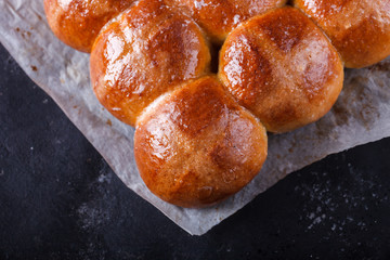 Easter Hot Cross Buns on a dark background.selective focus.