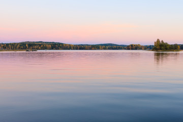 Serene lake scenery at dusk in Finland