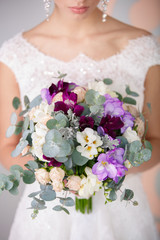 Bride with wedding flowers bouquet
