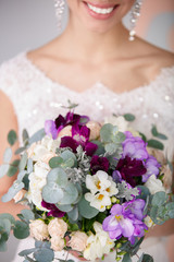 Bride with wedding flowers bouquet