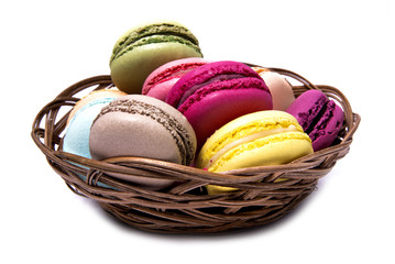 French Macaroons in basket isolated on white