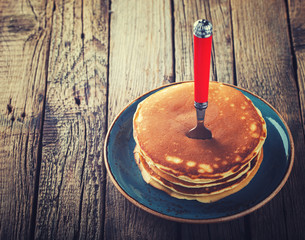 Pancake folded stack on wooden background.Toned image.Vintage style.selective focus.