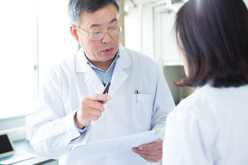 people doing chemical experiment in modern lab