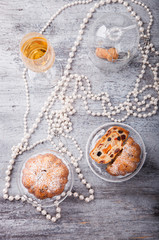 Fruit muffins with dried fruit and candied fruit decoration with pearls and a glass of champagne.selective focus.